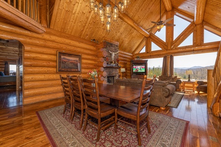 Dining table for 8 at God's Country, a 4 bedroom cabin rental located in Pigeon Forge