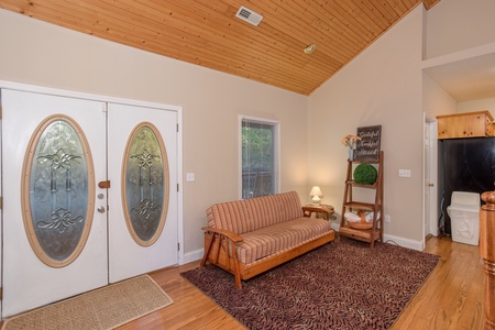 Seating area on the main floor at Into the Woods, a 3 bedroom cabin rental located in Pigeon Forge