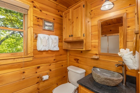 Bathroom with a custom sink at Moonlit Pines, a 2 bedroom cabin rental located in Pigeon Forge