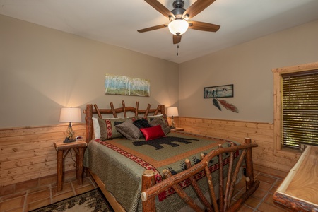 Bedroom with a log bed at Hawk's Heart Lodge, a 3 bedroom cabin rental located in Pigeon Forge