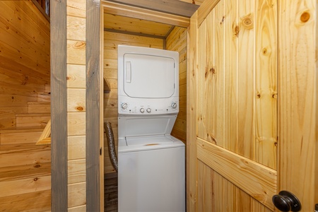 Stacked washer and dryer at Everly's Splash, a 4 bedroom cabin rental located in Pigeon Forge