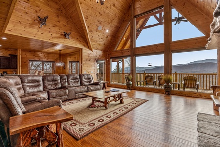 Oversized living room windows with mountain view at Four Seasons Grand, a 5 bedroom cabin rental located in Pigeon Forge