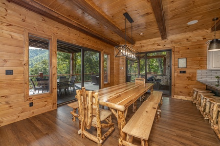 Large dining table at Black Bears & Biscuits Lodge, a 6 bedroom cabin rental located in Pigeon Forge