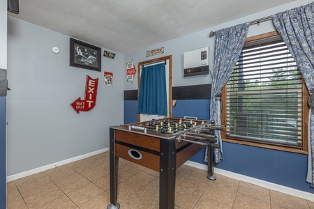 Foosball table in the game room at Bearing Views, a 3 bedroom cabin rental located in Pigeon Forge