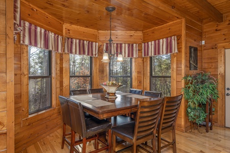 Dining table for 8 at King of the Mountain, a 3 bedroom cabin rental located in Pigeon Forge