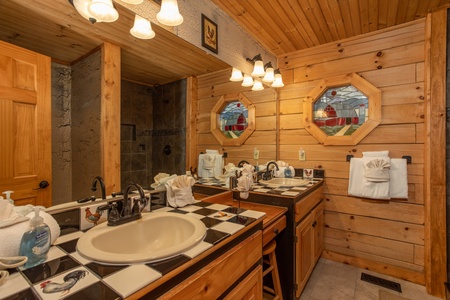 Bathroom with his and hers sinks at Fowl Play, a 1 bedroom cabin rental located in Pigeon Forge