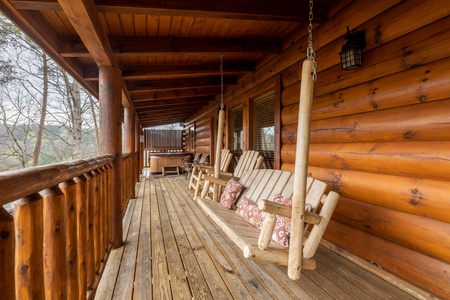 Swing on the deck at Absolutely Wonderful, a 2 bedroom cabin rental located in Pigeon Forge