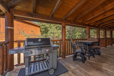 Gas grill on a covered deck at Bears Don't Bluff, a 3 bedroom cabin rental located in Pigeon Forge