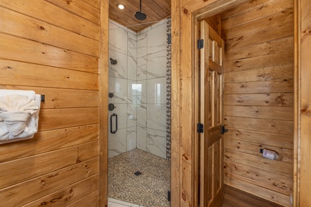 Shower in a corner at Black Bears & Biscuits Lodge, a 6 bedroom cabin rental located in Pigeon Forge