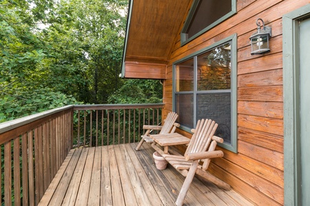 Deck with Adirondack chairs at Stones Throw, a 4 bedroom cabin rental located in Pigeon Forge
