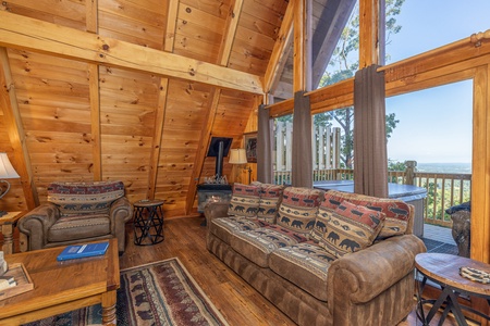 Living room seating at Cozy Mountain View, a 1 bedroom cabin rental located in Pigeon Forge