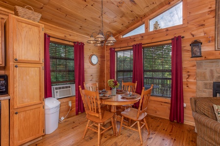 Dining table for four at A View for You, a 1 bedroom cabin rental located in Pigeon Forge