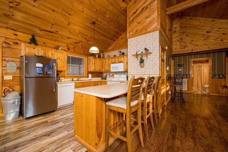 Interior view of kitchen and dining at Eagle's Loft, a 2 bedroom cabin rental located in Pigeon Forge