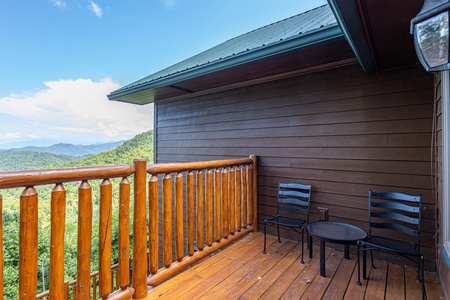 Small deck table and chairs for two at Sky View, A 4 bedroom cabin rental in Pigeon Forge