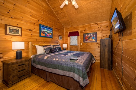 King bed at Moonlight in the Boondocks, a 2 bedroom cabin rental located in Gatlinburg