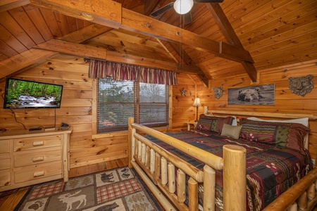 Loft bedroom with dresser and TV at Pigeon Forge Pleasures, a 3 bedroom cabin rental located in Pigeon Forge