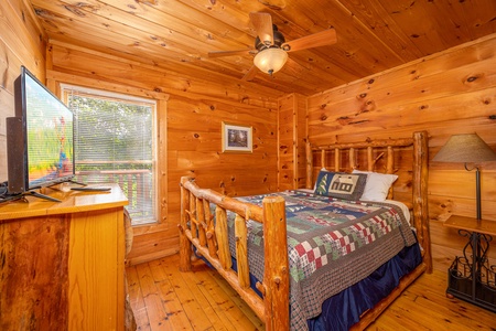 Main floor bedroom at American Dream, a 2 bedroom cabin rental located in Gatlinburg