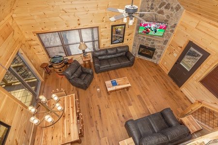 Looking down at the living room and dining room at Bessy Bears Cabin, a 2 bedroom cabin rental located inGatlinburg