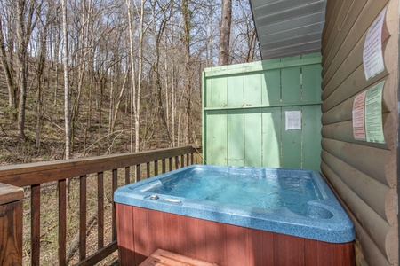 Hot tub and privacy fence on the deck at Bear Mountain Hollow, a 1 bedroom cabin rental located in Pigeon Forge
