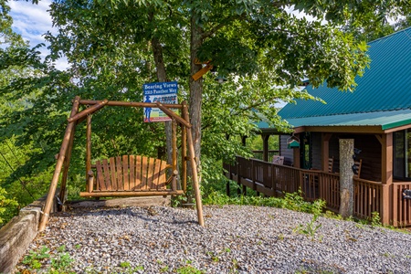 Swing in the yard at Bearing Views, a 3 bedroom cabin rental located in Pigeon Forge