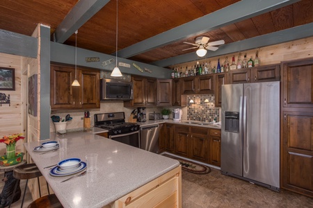 Kitchen with stainless appliances at Forever Country, a 3 bedroom cabin rental located in Pigeon Forge