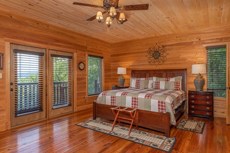 King bed and deck access at Sky View, A 4 bedroom cabin rental in Pigeon Forge