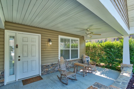 Front porch with rocking chairs at A Pigeon Forge Retreat, a 2 bedroom cabin rental located in Pigeon Forge