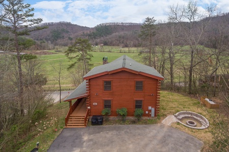 Ariel View of Cabin and fire pit with the meadow nearby at Mountain View Meadows, a 3 bedroom cabin rental located in Pigeon Forge