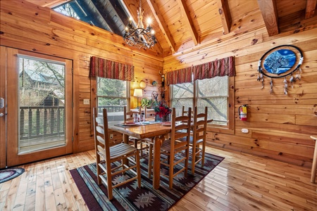Dining table with seating for six at Alpine Sondance, a 2 bedroom cabin rental located in Pigeon Forge