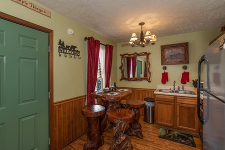 Dining space for four in the kitchen at Bear Mountain Hollow, a 1 bedroom cabin rental located in Pigeon Forge