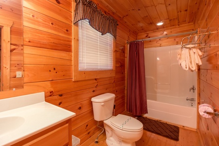 Bathroom with a tub and shower at A Beautiful Memory, a 4 bedroom cabin rental located in Pigeon Forge