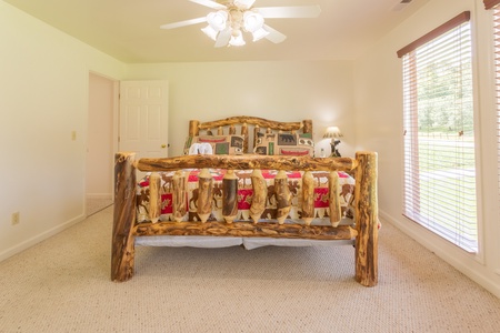 Upstairs queen bed at 1 Crazy Cub, a 4 bedroom cabin rental located in Pigeon Forge