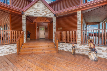 Entry porch at Four Seasons Palace, a 5-bedroom cabin rental located in Pigeon Forge