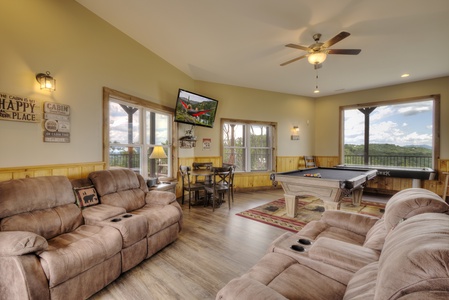 Game room with 2 relining loveseats at The Best View Lodge, a 5 bedroom cabin rental located in gatlinburg