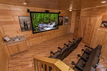 Theater room with a small wet bar at Patriot Pointe, a 5 bedroom cabin rental located in Pigeon Forge