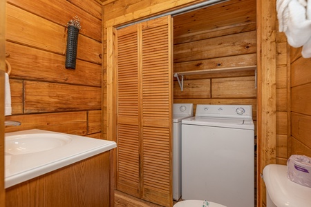 Washer and dryer in a bathroom at Walkin' To Gatlinburg, a 2 bedroom cabin rental located in Gatlinburg