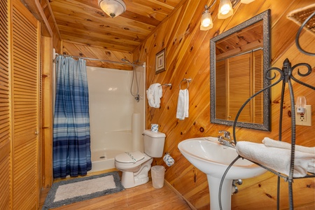 Bathroom with tub and shower at Hatcher Mountain Retreat a 2 bedroom cabin rental located in Pigeon Forge