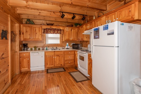 Kitchen with white appliances at Bearly Mine, a 1 bedroom Pigeon Forge cabin rental