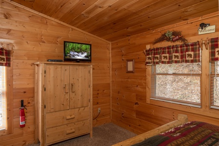 Armoire and TV in the bedroom at Bearly Mine, a 1 bedroom Pigeon Forge cabin rental
