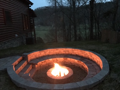 Fire pit at night at Mountain View Meadows, a 3 bedroom cabin rental located in Pigeon Forge