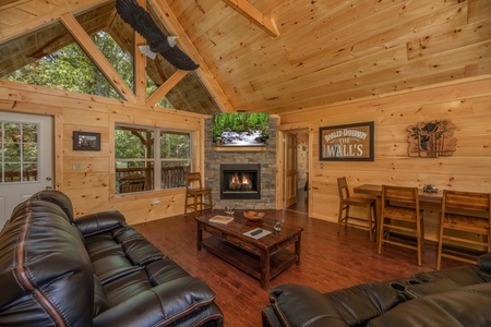 Living room with fireplace and TV at Gar Bear's Hideaway, a 3 bedroom cabin rental located in Pigeon Forge