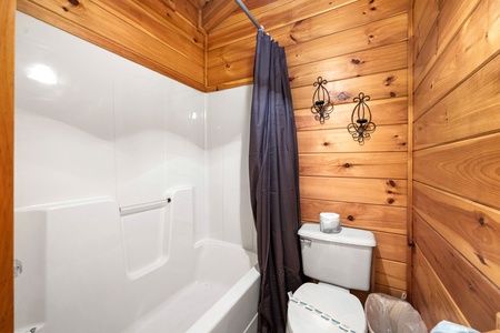 Bathroom with tub and shower combo at Alpine Sondance, a 2 bedroom cabin rental located in Pigeon Forge