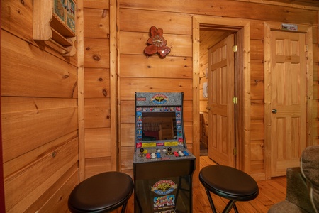 Multigame arcade at Logan's Smoky Den, a 2 bedroom cabin rental located in Pigeon Forge