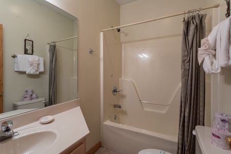 Bathroom with a tub and shower at Starry Starry Night #725, a 2 bedroom cabin rental located in Pigeon Forge