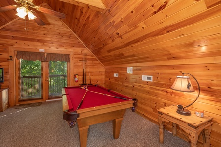 Red felt pool table in the loft at Grand View, a 3 bedroom cabin rental located in Sevierville