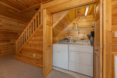 Laundry space under the stairs at Sensational Views, a 3 bedroom cabin rental located in Gatlinburg