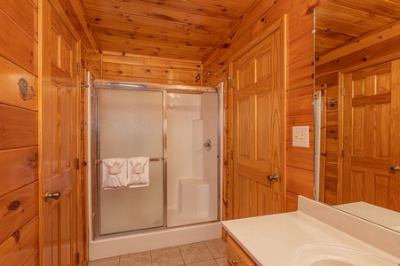 Bathroom with shower at Hickernut Lodge, a 5-bedroom cabin rental located in Pigeon Forge
