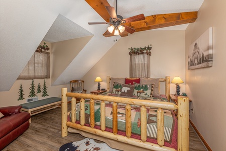 Loft log bed at Magic Moments, a 2 bedroom cabin rental located in Pigeon Forge