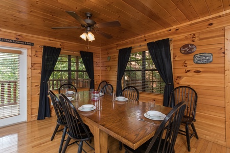 Dining table for 8 Kick Back & Relax! A 4 bedroom cabin rental located in Pigeon Forge