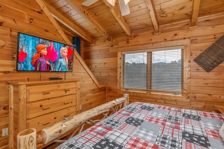 TV and dresser in a bedroom at Mountain Mama, a 3 bedroom cabin rental located in Pigeon Forge